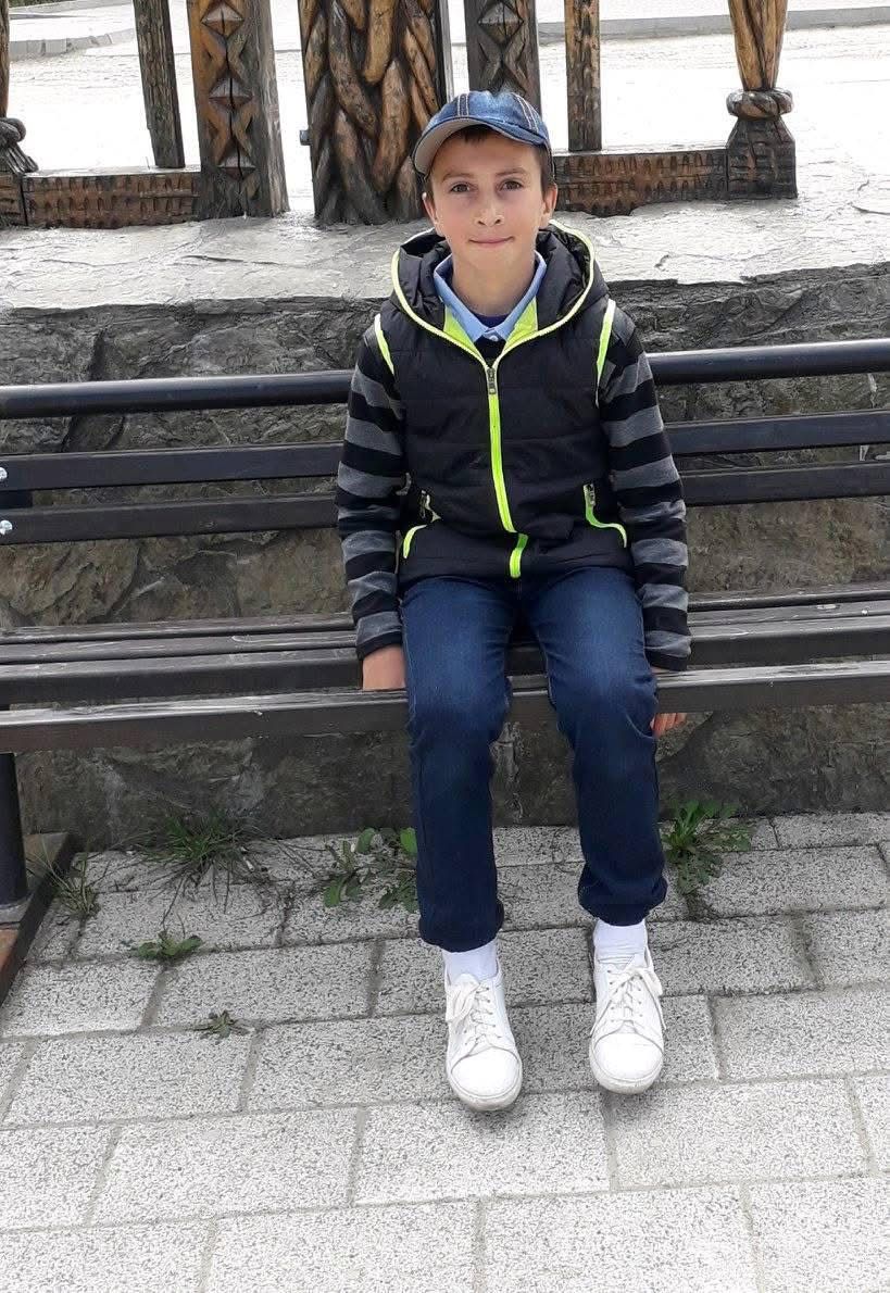 Young Aman sitting on a bench